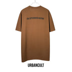 Urban Cult brown cotton t-shirt with "IN STORES NOW" graphic on back, size L