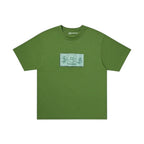Urban Cult x CPFM T-Shirt Verde Oliva in cotone con grafica "Dollar" e faccina sorridente.
