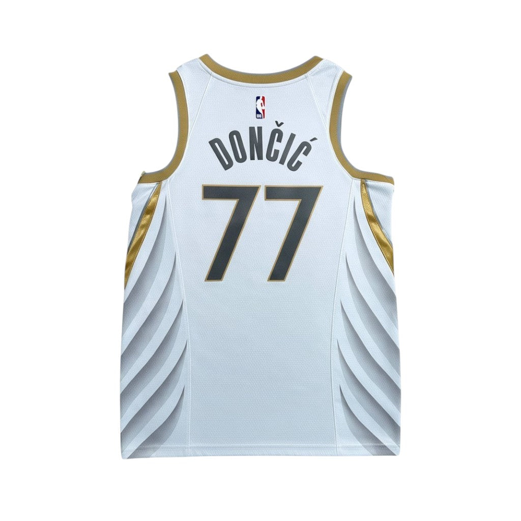 Urban Cult white NBA Dallas Mavericks 2019/2020 Luka Doncic 77 jersey with gold trim and blue numbers.