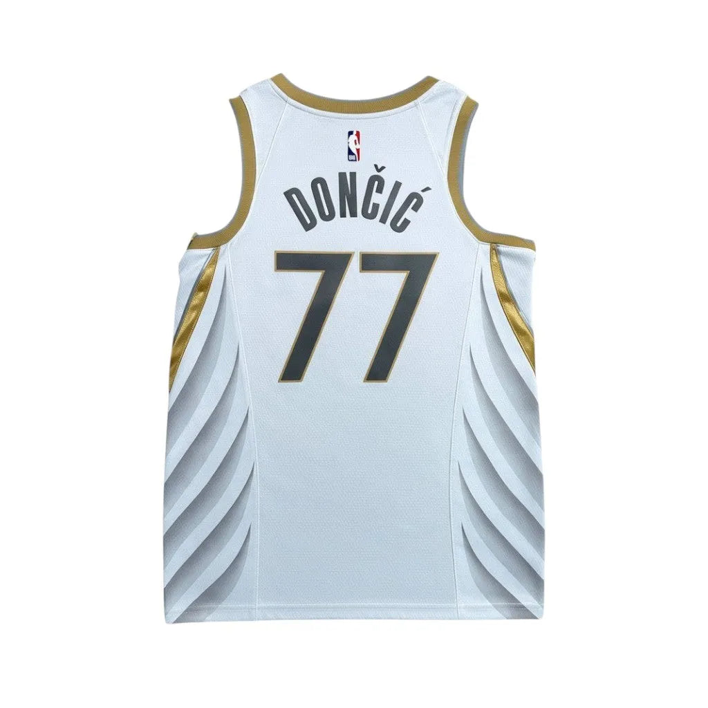 Urban Cult white NBA Dallas Mavericks 2019/2020 Luka Doncic 77 jersey with gold trim and blue numbers.
