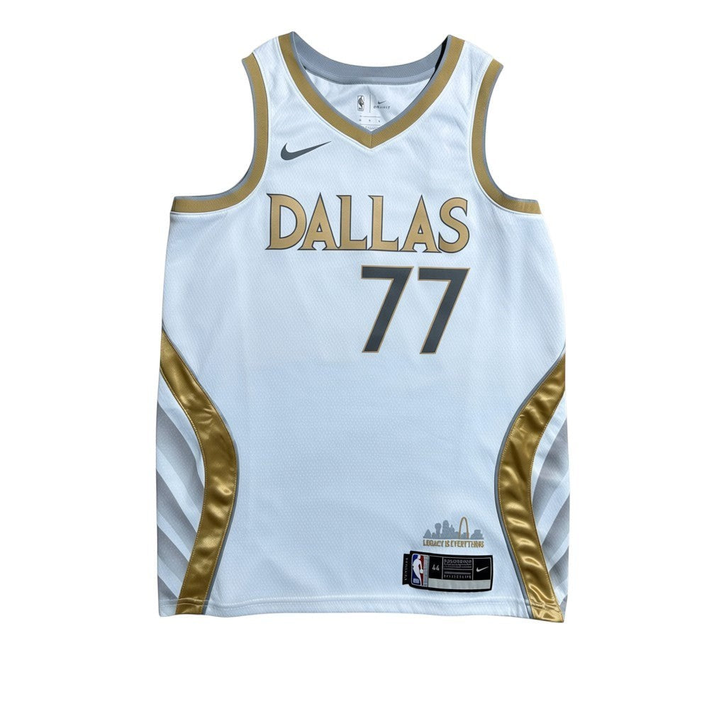 Urban Cult white Nike NBA Dallas Mavericks 2019/2020 Luka Doncic 77 jersey with gold trim and blue numbers.