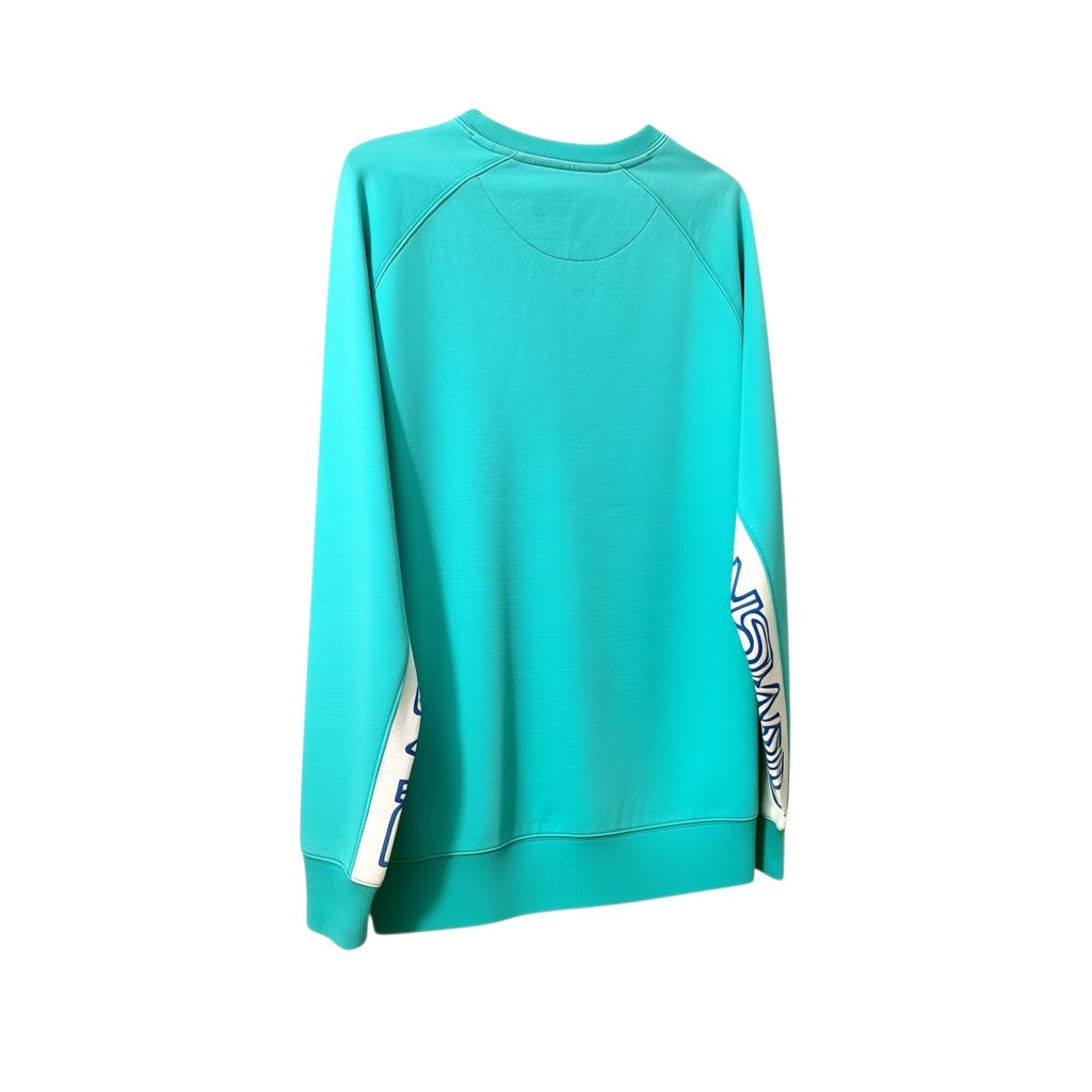 Felpa girocollo Palace Utopians Sport azzurra con pannelli laterali bianchi e logo futuristico. Maniche raglan, vestibilità rilassata.