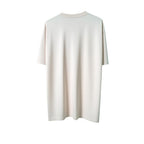 Urban Cult T-shirt Patta 'Healing Hands' Pink, cotone pesante, vestibilità relax, grafica centrale mano ai raggi X con gioielli e aura verde neon.