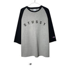 Urban Cult Stüssy x Champion baseball t-shirt, grey body, blue 3/4 sleeves, size L, cotton