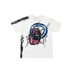 Urban Cult white cotton t-shirt with Travis Scott x Fragment 'Sunrise' graphic, featuring a purple face and blue circles.