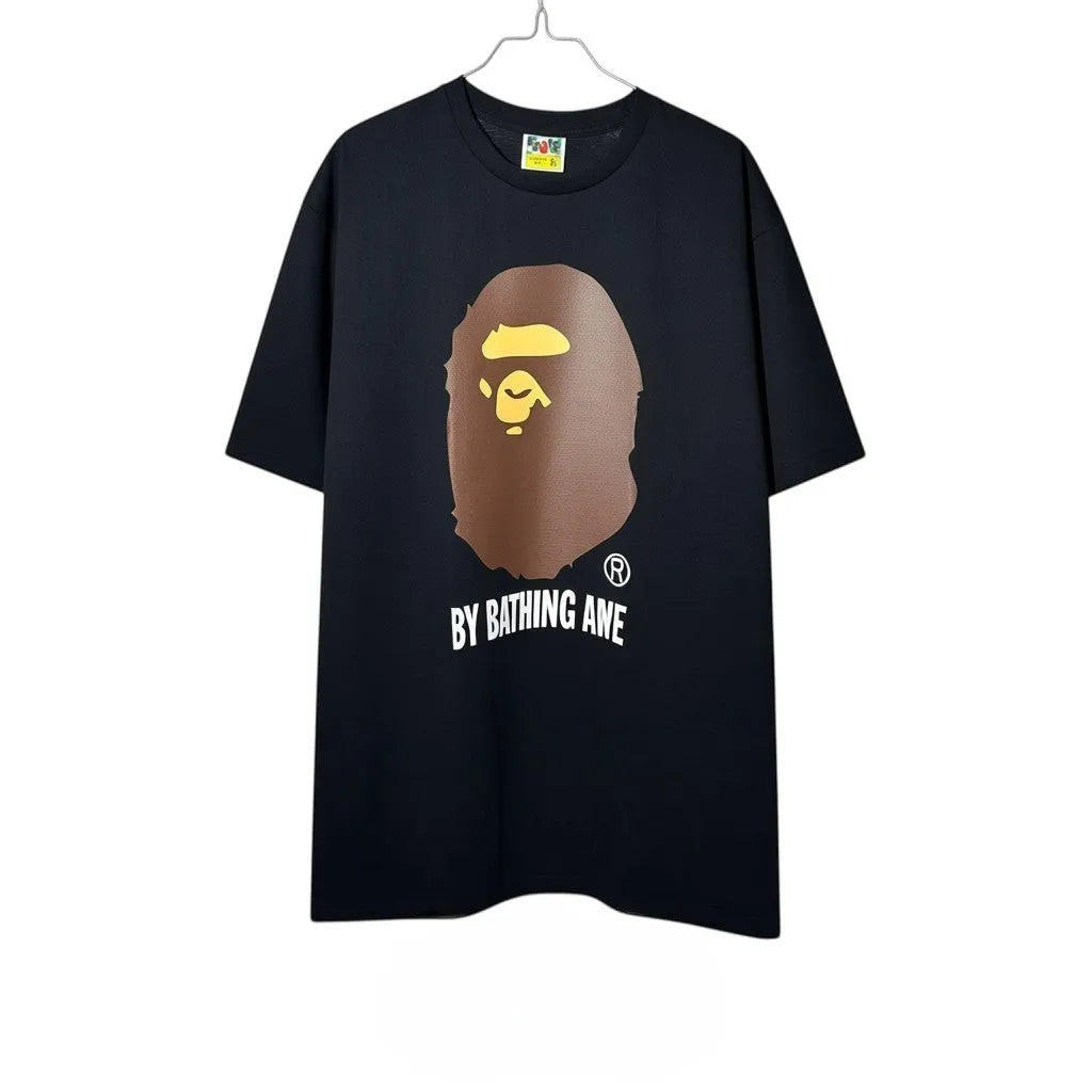 Urban Cult T-Shirt BAPE A Bathing Ape Nera in cotone con iconico logo Ape Head marrone e giallo.
