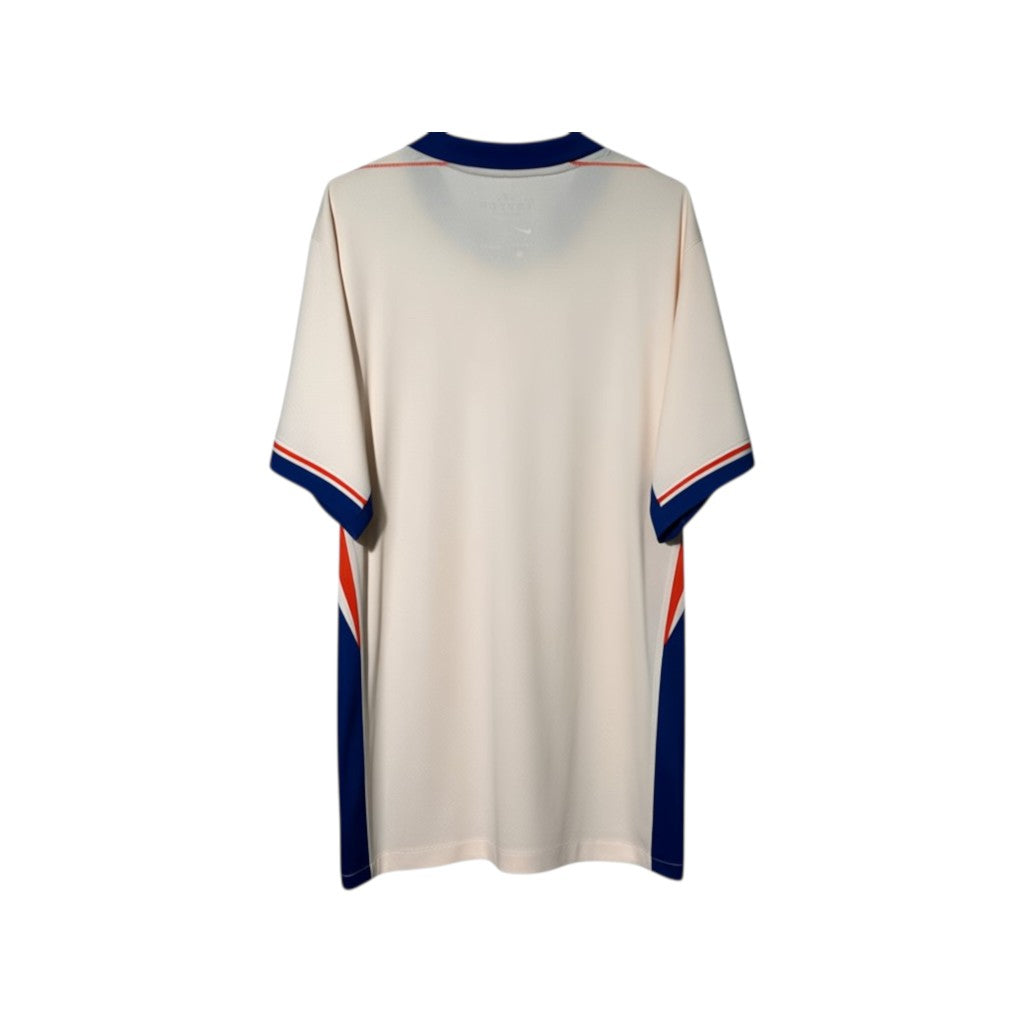 Urban Cult Chelsea FC 2024/2025 Away jersey in pink and blue, size XL. Features contrasting blue and orange side panels and collar.