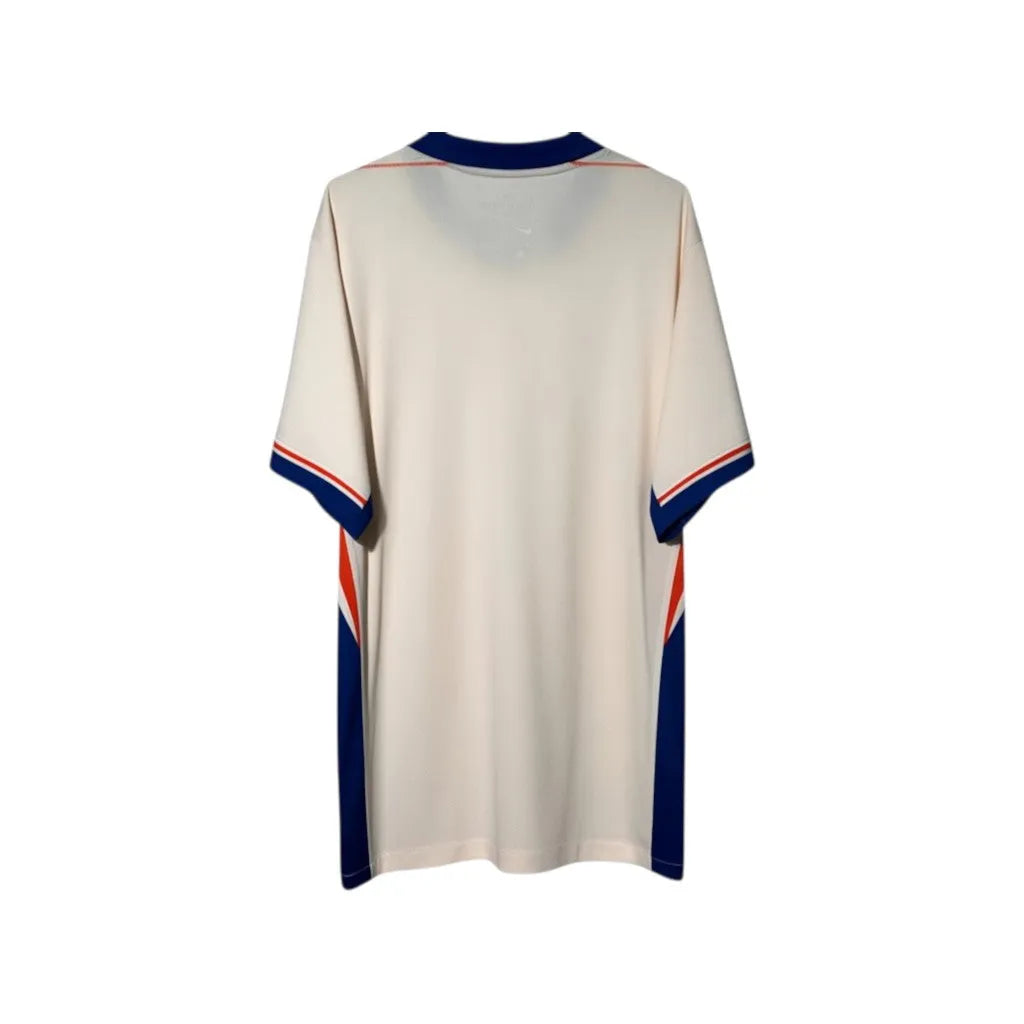 Urban Cult Chelsea FC 2024/2025 Away jersey in pink and blue, size XL. Features contrasting blue and orange side panels and collar.