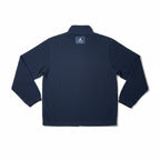 Urban Cult Giacca Jordan x Union MJ Track Jacket blu navy in tessuto tecnico fleece, taglia S, con logo Jordan e Union sul retro.