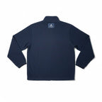Urban Cult Giacca Jordan x Union MJ Track Jacket blu navy in tessuto tecnico fleece, taglia S, con logo Jordan e Union sul retro.