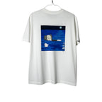Urban Cult white 100% cotton t-shirt with KAWS x UNIQLO 'Artbook Cover' graphic print of Companion character floating in water.