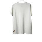 Urban Cult white cotton t-shirt with KAWS x Uniqlo Sesame Street Companion Outline graphic on front