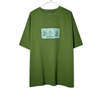 Urban Cult olive green cotton t-shirt with CPFM SpongeBob "Dollar" graphic print on chest.