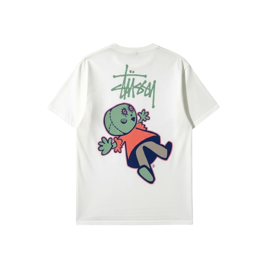 Urban Cult white pigment-dyed cotton t-shirt with Stüssy logo and playful 'Dollie' graphic on back.