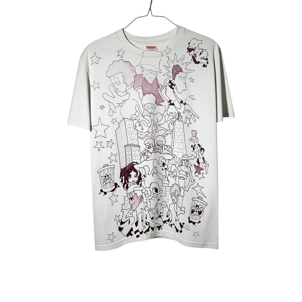 Urban Cult white cotton graphic t-shirt, size S, with a cartoonish cityscape and character print. FW23 collection.