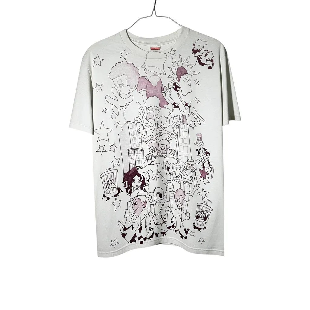 Urban Cult white cotton graphic t-shirt, size S, with a cartoonish cityscape and character print. FW23 collection.